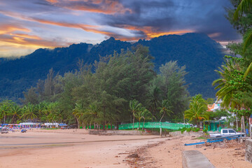 Fototapeta na wymiar Colourful Skies Sunset over Kamala Beach in Phuket Thailand. This Lovely island waters are turquoise blue waters, lush green mountains colourful skies and beautiful views of Pa Tong Patong