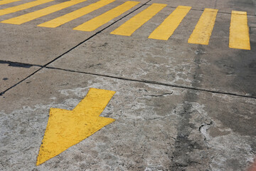 yellow arrow on asphalt