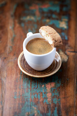 Cup of coffee and Cantuccini (Italian cookie) on dark wooden background. Copy space.