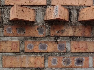 wall of brown brick house
