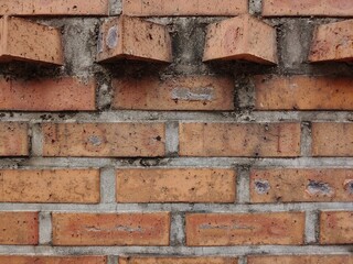 wall of brown brick house

