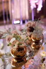 Obraz na płótnie Canvas Bouquet of flowers in vase on the wedding table