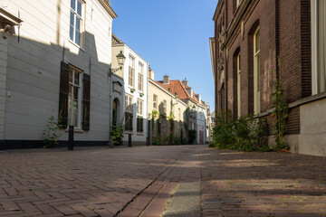 Clarastreet in the direction of the Hinthamerstraat. The sun is shining on a part of the left...