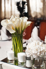 Bouquet of flowers in vase on the wedding table