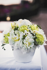 Bouquet of flowers in vase on the wedding table
