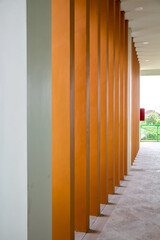 The cream color wall pillar in the hallway of the building