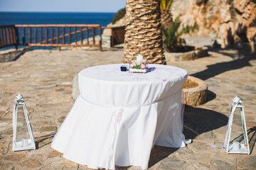 Flowers in a vase and a box for rings at a wedding ceremony