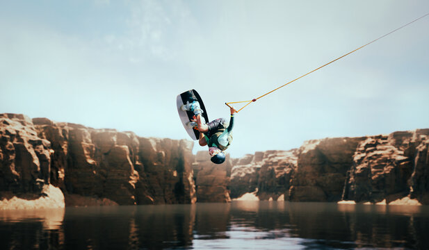 Wakeboarder making tricks on the river. Wakeboarding. Water sports. - Powered by Adobe
