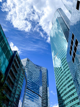 blue sky framed by the tops of skyscrapers, Moscow Manhattan, Moscow-City district, glass skyscrapers, business center, summer evening
