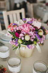 Bouquet of flowers in vase on the wedding table