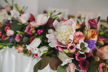 Bouquet of flowers in vase on the wedding table