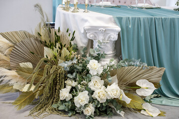 Bouquet of flowers in vase near the wedding table