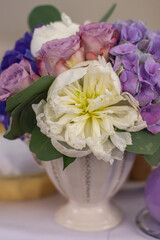Bouquet of flowers in vase on the wedding table