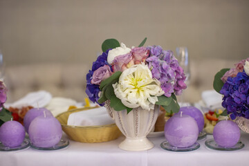 Bouquet of flowers in vase on the wedding table