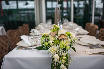 Bouquet of flowers in vase on the wedding table