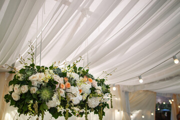 Bouquet of flowers in vase on the wedding table