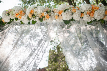 Flowers on the arch for the wedding ceremony