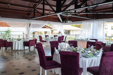 Decorated served tables for wedding party or other formal dinner