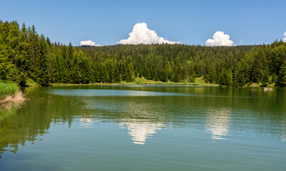 Lake Tret is among the most beautiful forest lakes of South Tyrol, Italy - the lake is surrounded...