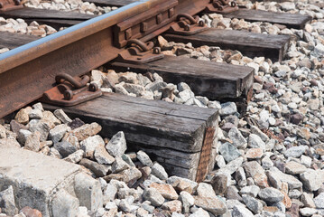 selective focus of wooden sleepers and railway tracks
