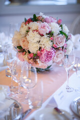 Bouquet of flowers in vase on the wedding table