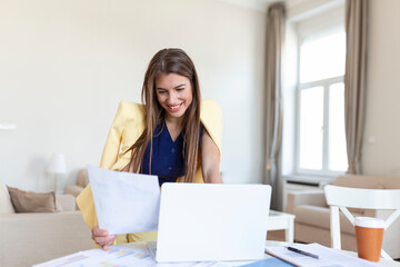 Entrepreneurship. Business Woman Checking Documents Using Laptop Working Standing In Home Office. Free Space, Selective Focus