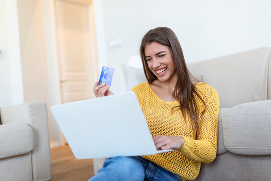 Picture showing pretty woman shopping online with credit card. woman holding credit card and using laptop. Online shopping concept