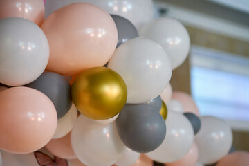 Decoration of balls for the holiday in pink, white and gray colors