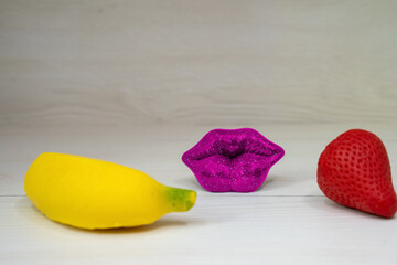 sexy hot lips and fruits banana strawberry, concept of oral sex