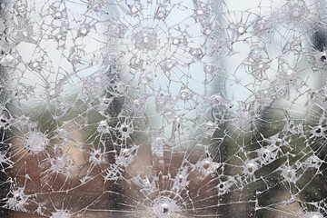 group of bullet holes on the glass abstract background window