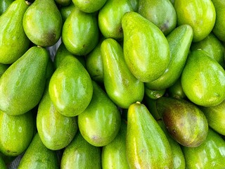 Close-photo of avocado in a fruit market.