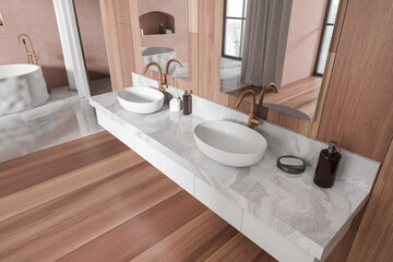 Top view of modern bathroom interior with sink and mirror, accessories on deck