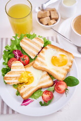 Heart shaped Fried Egg on Toast Bread and cup of fresh hot espresso coffee