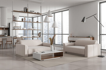 Light kitchen interior with soft armchairs and coffee table, panoramic window