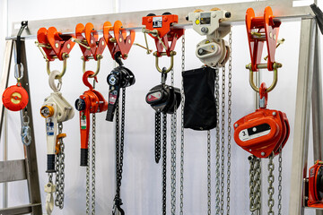 Close up various kind of industrial manual chain hoist such as hand pull and lever type for lifting...
