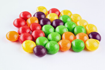 Chocolate coated Peanuts. Colorful chocolate buttons, on white background.