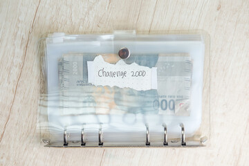 Daily financial bookkeeping with 2000 rupiah banknote challenge