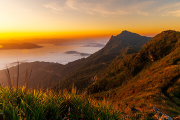 Landscape of the mountain and sea of mist in winter gold sunrise view from top of Phu Chi Dao mountain , Chiang Rai, Thailand