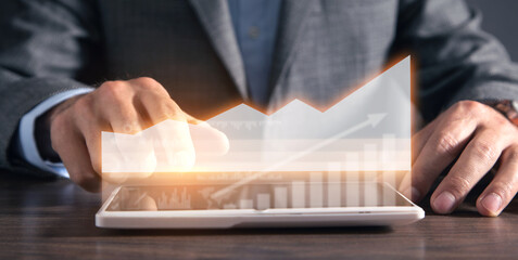 Man using tablet with business graph. Growth. Business. Success