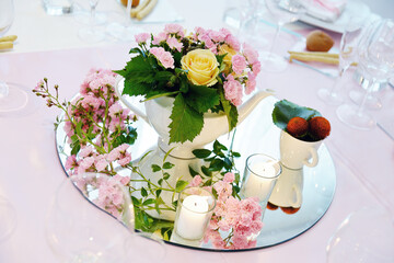 Detail of a table set in pink for a wedding banquet