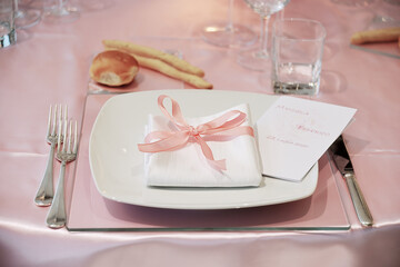 Detail of a table set in pink for a wedding banquet