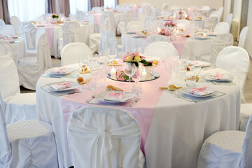 Detail of a table set in pink for a wedding banquet