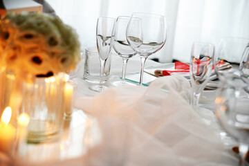 Detail of centerpiece with lantern flowers and candles for wedding banquet