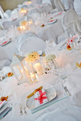 Detail of a table set with white organza for a wedding banquet