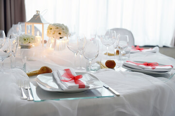 Detail of a table set with white organza for a wedding banquet