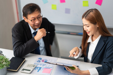 Business partnership concept, Businesswoman pointing at document during senior consultation