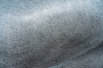 wall graffiti texture of aerosol spray drawing on a city wall , colored abstract wallpaper in urban style