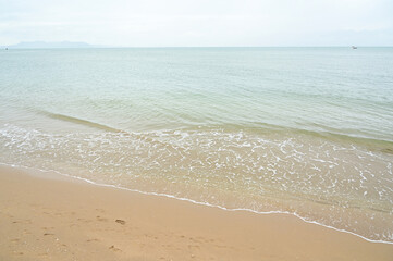 Fototapeta na wymiar sea and sand with blue sky, natural background