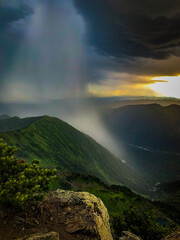Fototapeta premium Clouds and rain over the mountains