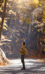 Fototapeta premium Young handsome man posing in autumn forest.